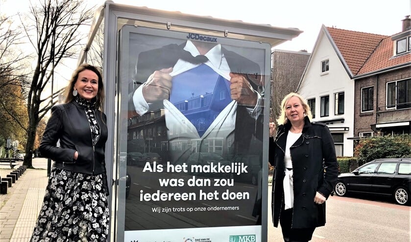 <p>Wethouder Astrid van Eekelen en voorzitter MKB L'dam-V'burg Benedikte Zijlstra bij een poster van de campagne (foto: gemeente LV).</p>